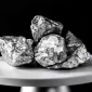 pieces of platinum ore sitting on round platform_11zon 85x85